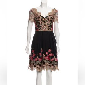 Marchesa Notte A-Line Dress
Black
Embroidered Accent
Short Sleeve with V-Neck